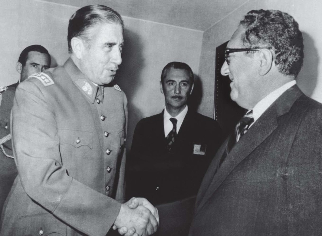 Chilean president Augusto Pinochet greets US secretary of state Henry Kissinger on his arrival at Pinochet’s office, June 8, 1976.