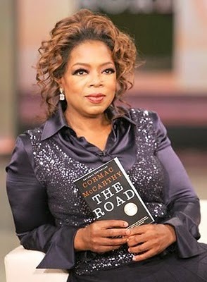 Oprah Winfrey posing with her favorite post-apocalyptic beach read.