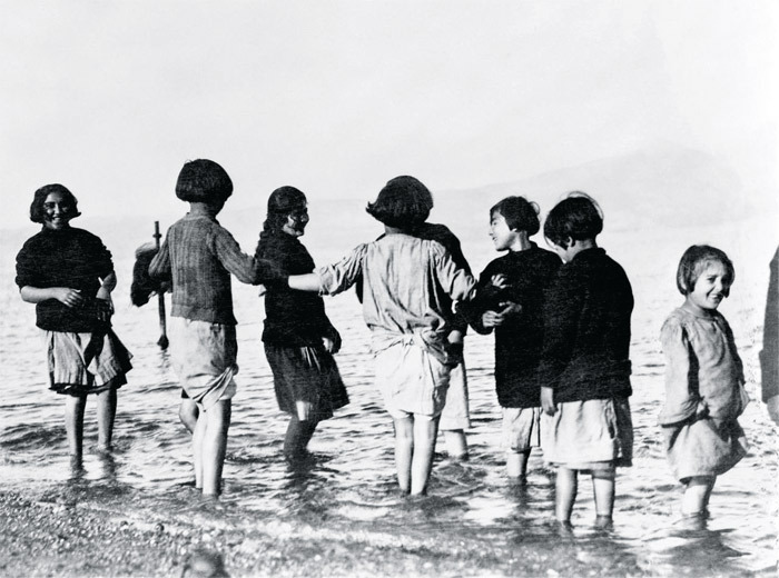 Greek and Armenian orphan refugees experiencing the sea for the first time, Marathon, Greece.