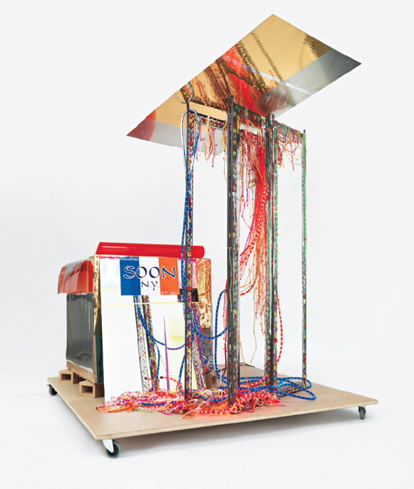 Isa Genzken, Disco Soon (Ground Zero), 2008, cardboard, plastic, mirror, spray paint, synthetic polymer, metal, fabric, light ropes, foil, paper, fiberboard, casters, 86 1/2 x 80 3/4 x 65".