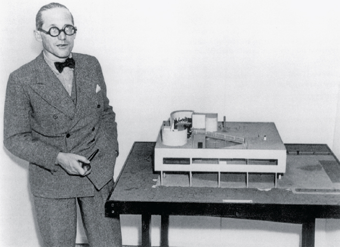 Le Corbusier with a model of the Villa Savoye, 1935.