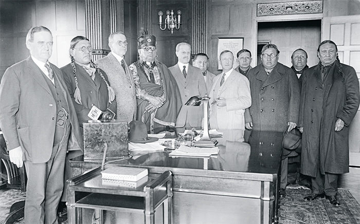 A meeting of the Council of the Osage Indian Tribe and United States government officials in Washington, DC, ca. 1921–24.Harris & Ewing/Library of Congress.