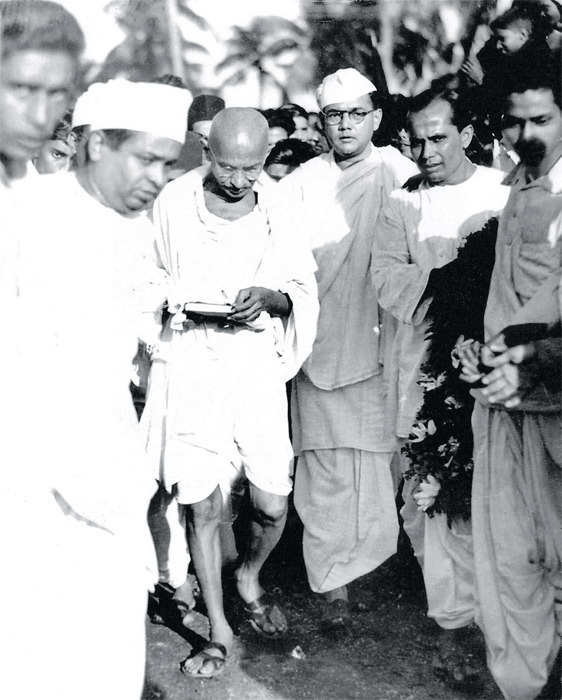 Gandhi pays a visit to Subhas Chandra Bose (in glasses and cap), Calcutta, 1937.