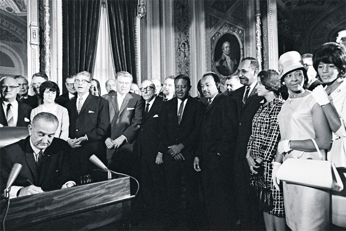 President Lyndon Johnson signs the Voting Rights Act, Washington, DC, 1965.