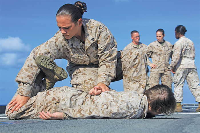 A marine demonstrates takedown and restraint, 2010.