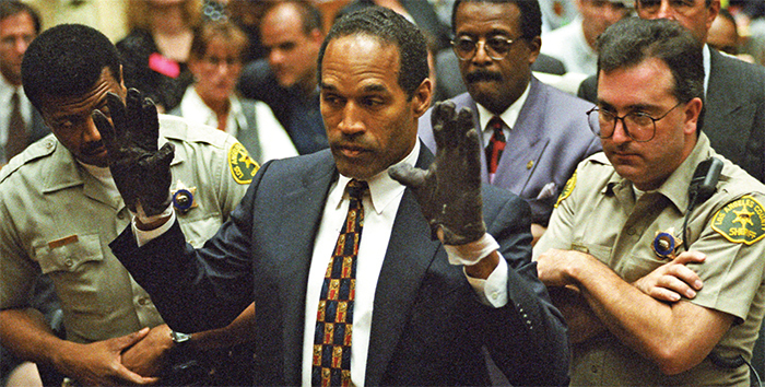 O.J. Simpson wearing gloves found at the scene of his ex-wife’s murder, June 15, 1995. Sam Mircovich/Reuters/Files.