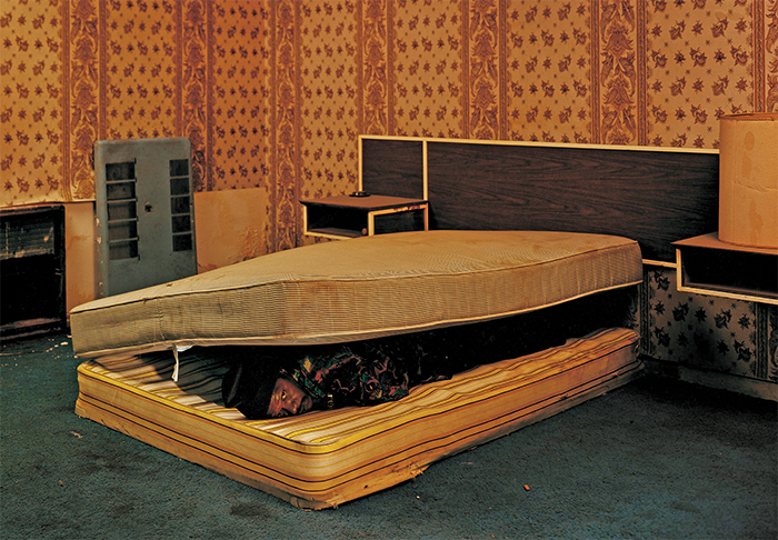 Taryn Simon, Larry Mayes, Scene of arrest, The Royal Inn, Gary, Indiana, Police found Mayes hiding beneath a mattress in this room (Served 18.5 years of an 80-year sentence for Rape, Robbery and Unlawful Deviate Conduct), 2002, ink-jet print, 48 × 62.
