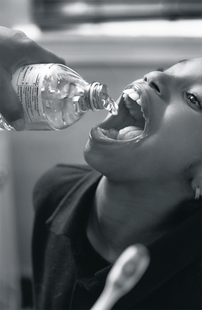 LaToya Ruby Frazier, Shea brushing Zion’s teeth with bottled water in her bathroom, 2016, gelatin silver print, dimensions variable. From the series “Flint Is Family,” 2016–17. Courtesy the Artist and Gavin Brown’s Enterprise, New York / Rome.