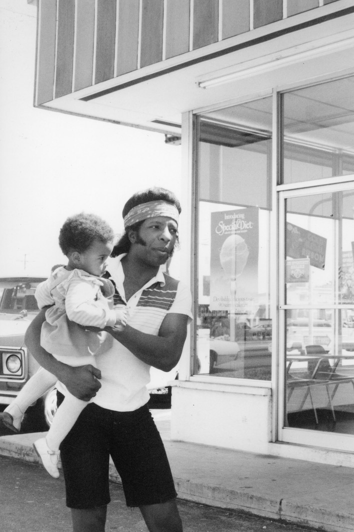 Sly Stone with daughter Nove, ca. 1980.